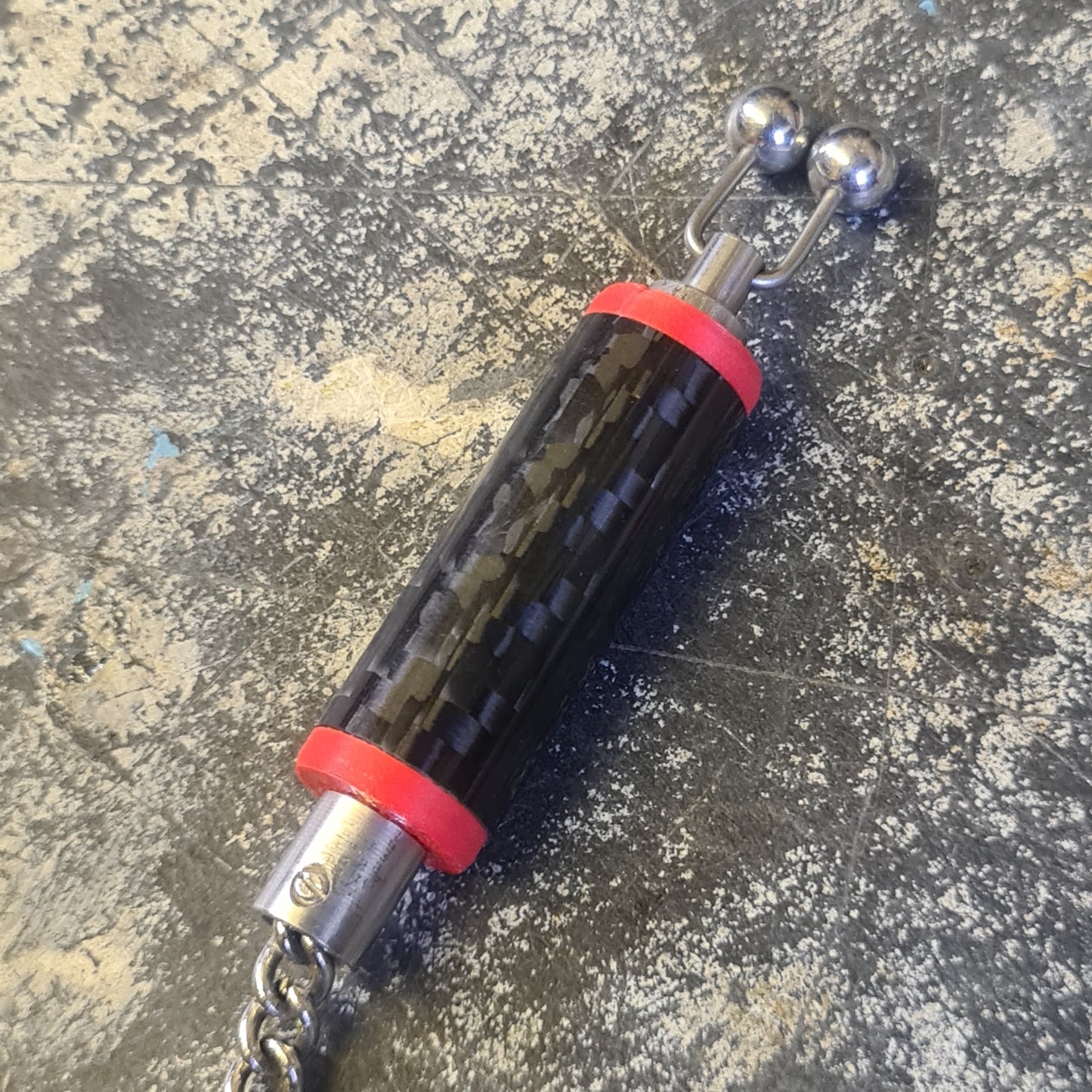 Carbon fibre bobbin with ball clip and stainless chain